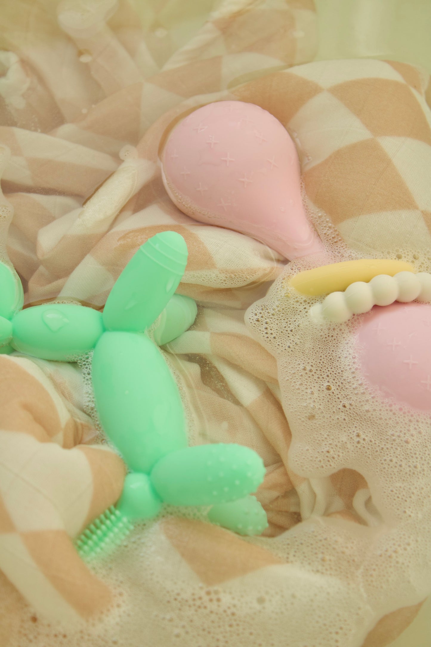 puffling gumdrop rattle, pink baby rattle, pink baby teether with teething rings, baby toy, nontoxic baby toy, bath view with party animal teether
