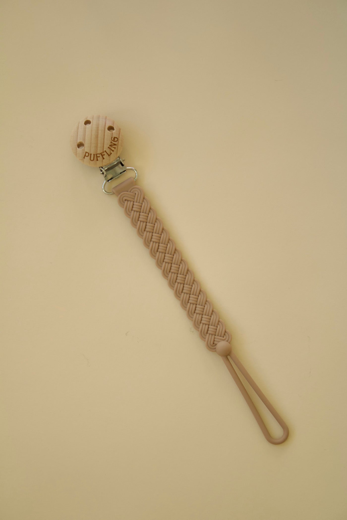 Puffling Woven Anti-drop Pacifier Clip, mushie pacifier clip, dummy clip, binky clip, silicone pacifier clip, clay brown color, diagonal view