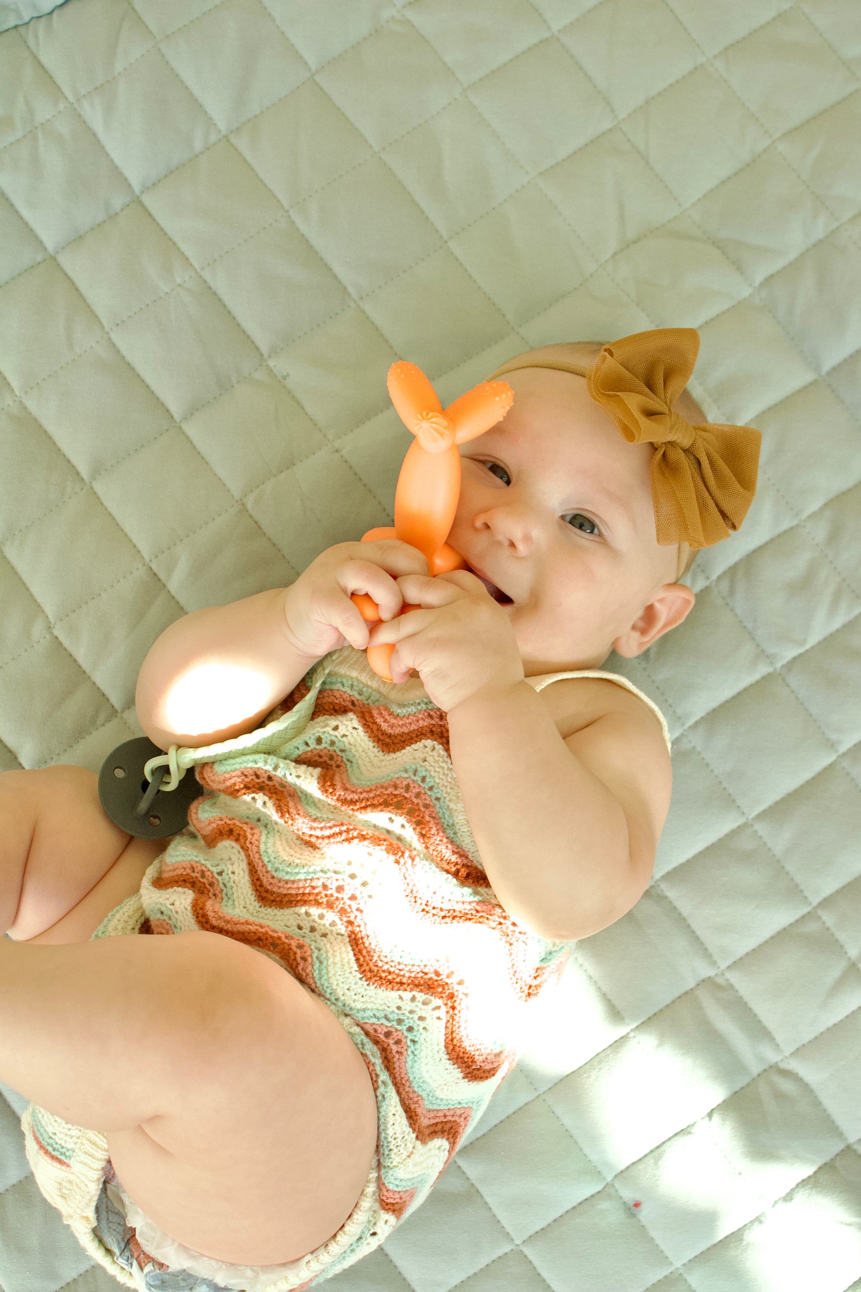 Puffling Party Animal Teether, Clementine Orange Color, nontoxic baby teether, teething toy, silicone, mushie, mushie teether, baby chewing on teether