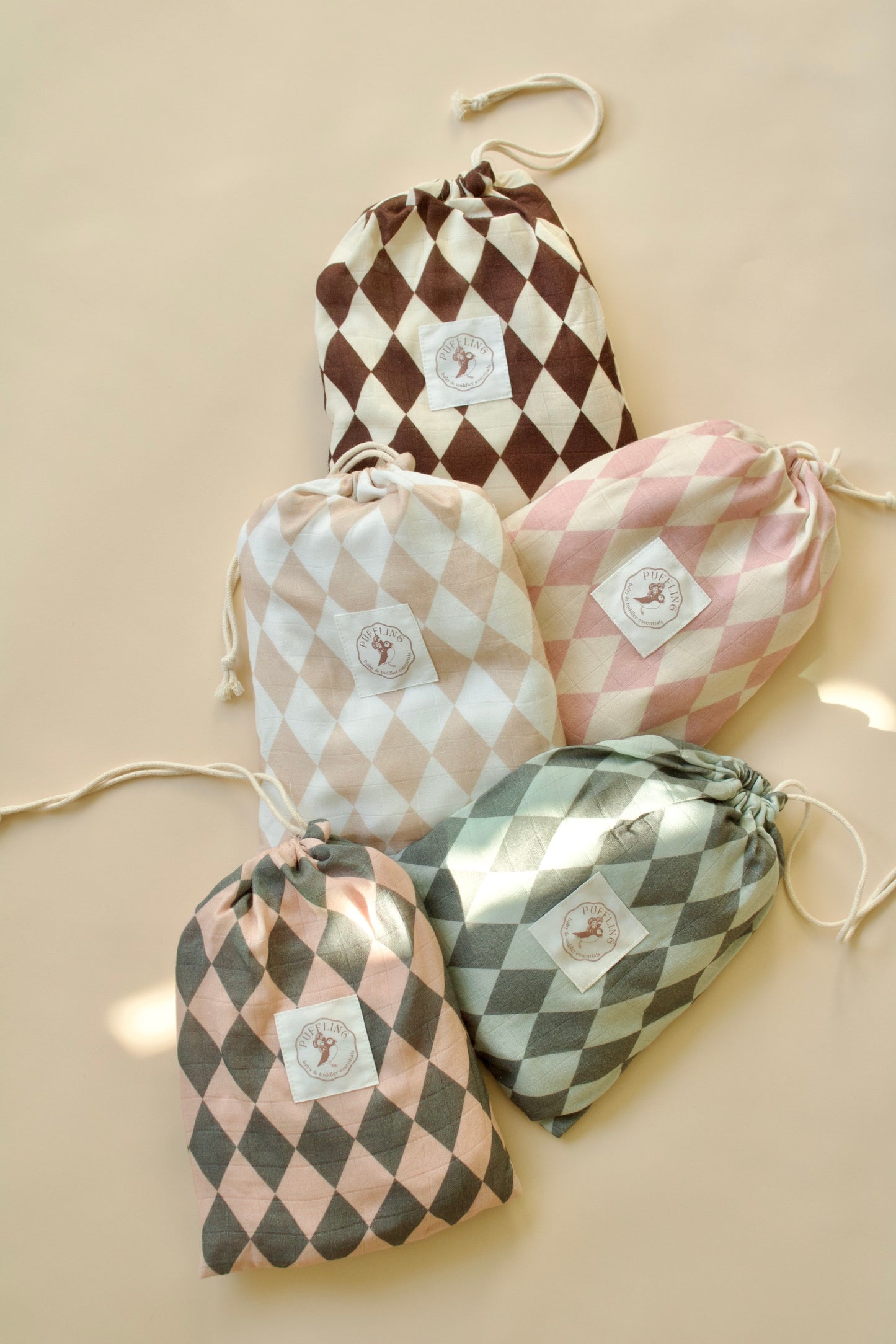 Puffling Supremely-Soft Swaddle, Organic bamboo and muslin cotton, baby swaddle blanket, checkered pattern, checkerboard blanket, soft baby blanket, neutral baby blanket, swirled view, view of all diamond patterns