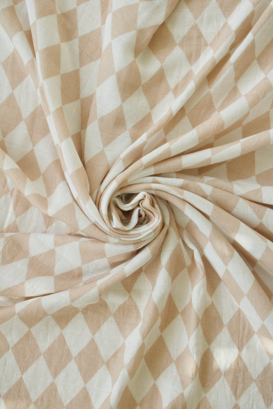 Puffling Supremely-Soft Swaddle, Organic bamboo and muslin cotton, baby swaddle blanket, checkered pattern, checkerboard blanket, soft baby blanket, neutral baby blanket, swirled view