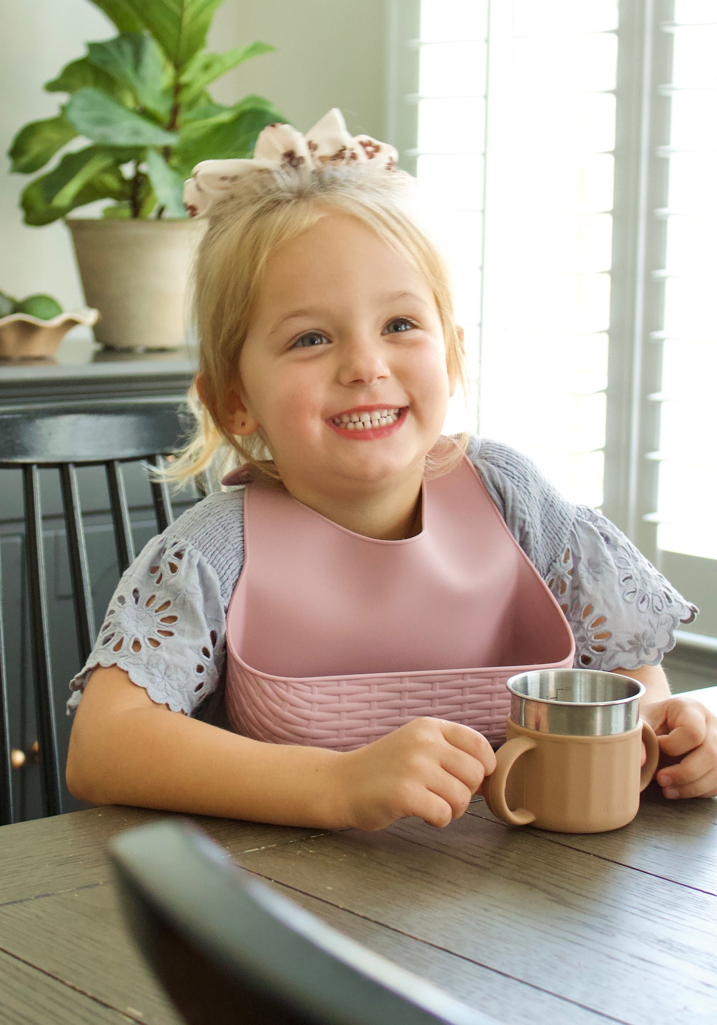 Puffling Essential Sippy Cup, stainless steel sippy cup, silicone sippy cup, nontoxic toddler cup, brown, mushie bib, hazelnut color, unbreakable, leakproof, child drinking from cup