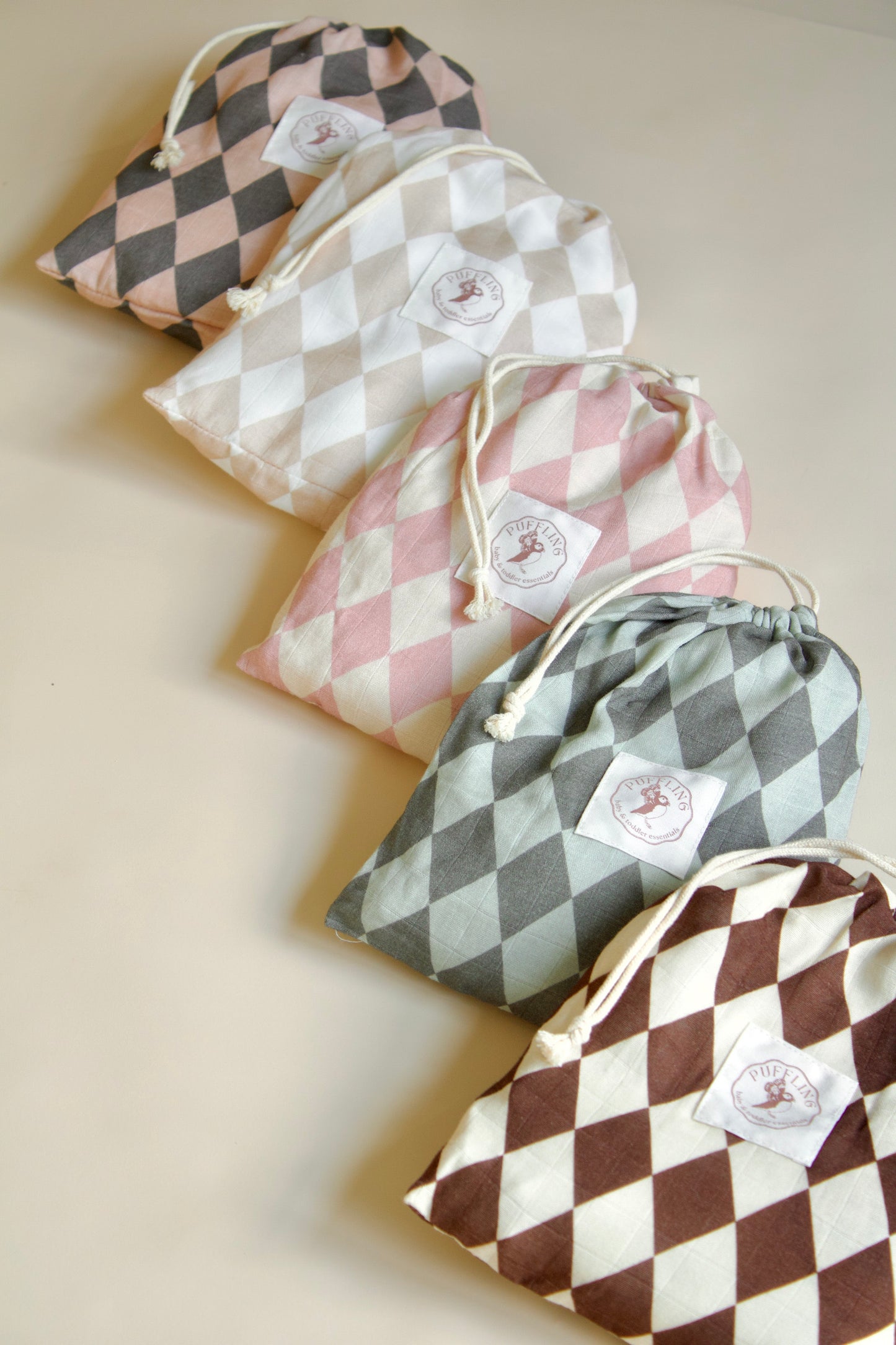 Puffling Supremely-Soft Swaddle, Organic bamboo and muslin cotton, baby swaddle blanket, checkered pattern, checkerboard blanket, soft baby blanket, neutral baby blanket, lined up view